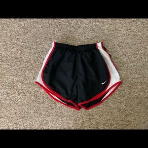 Black, white and red Nike shorts. Size small.